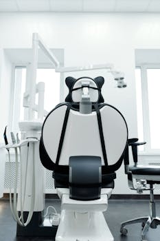 Bright dental clinic room with a modern dental chair and equipment. Ideal for healthcare imagery.