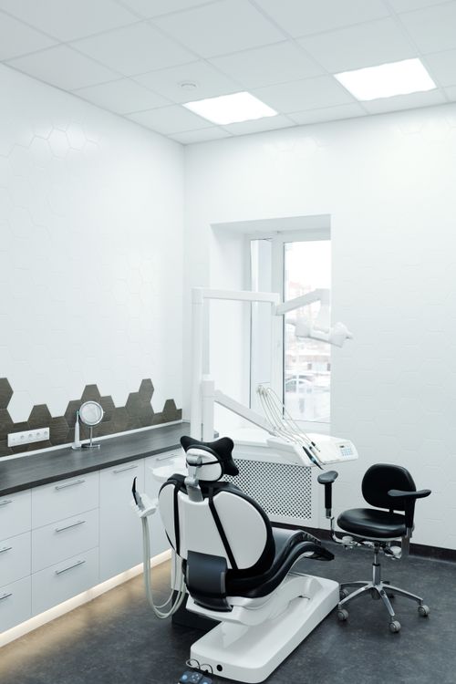 Free A bright, clean dental clinic showcasing a modern dental chair and equipment. Stock Photo