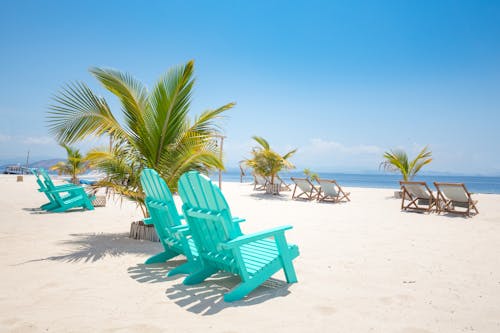 Free Photograph of Blue Chairs at the Beach Stock Photo