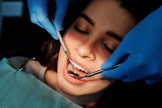 Close-up of a dental examination showing a woman patient receiving dental care from a professional.