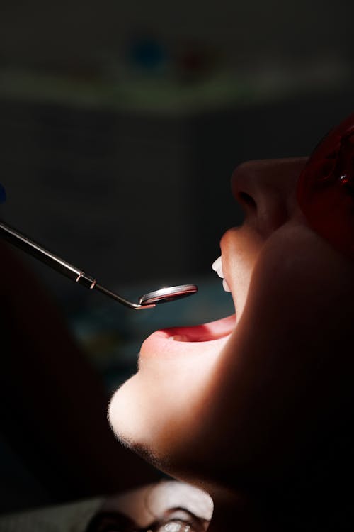 Free A Dental Tool in Front of a Mouth Stock Photo