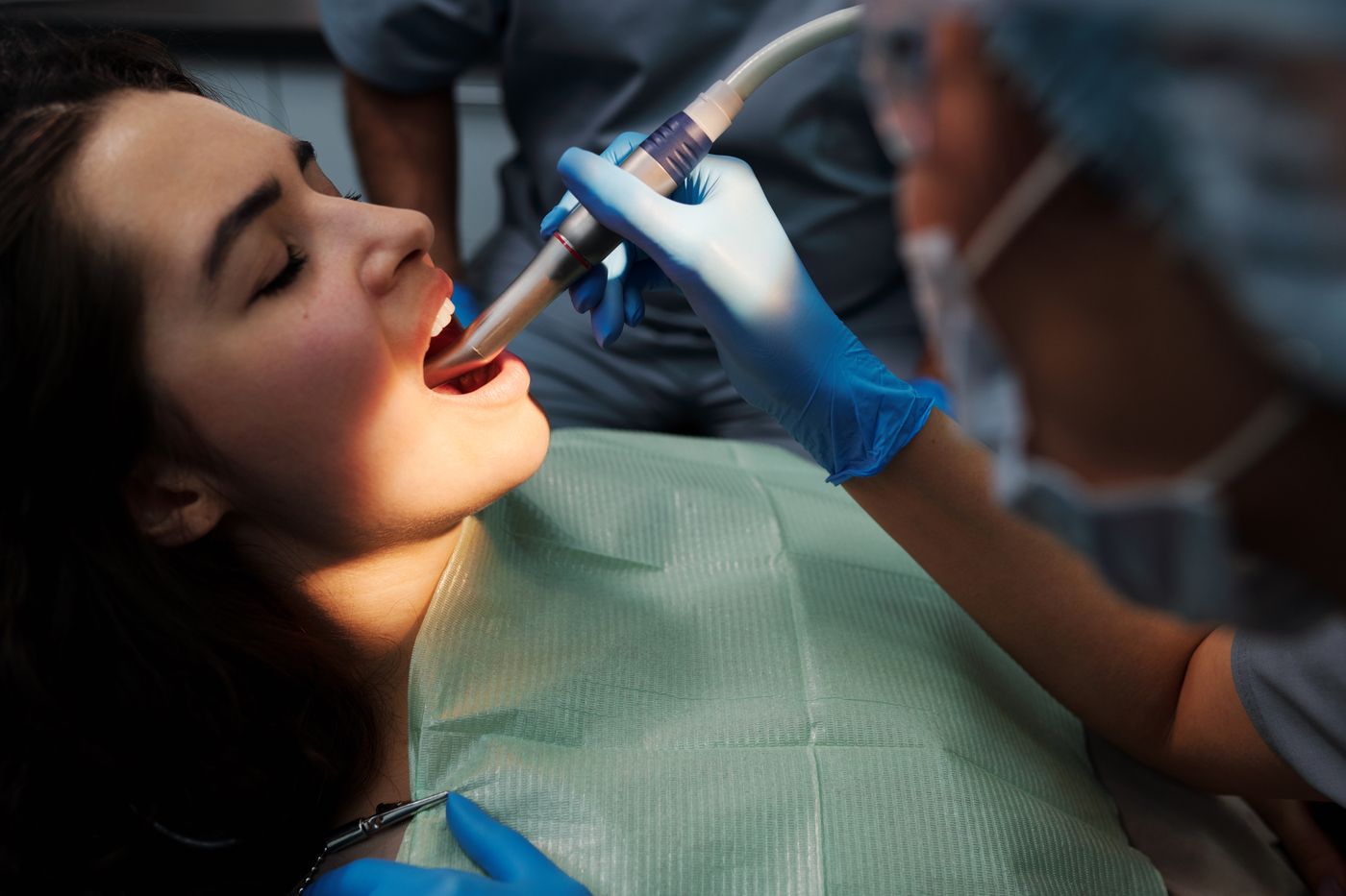 Patient being scanned with modern dental imaging equipment