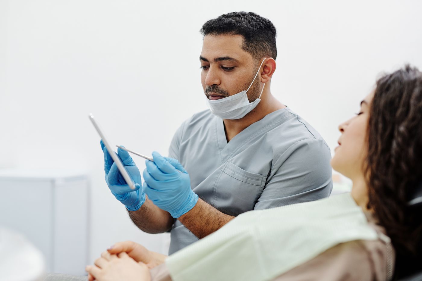 Healthcare professional reviewing patient information on a tablet