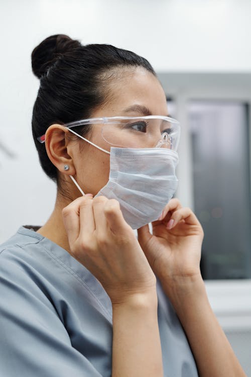 Free Photo Of Woman Wearing Protective Goggles And Mask Stock Photo