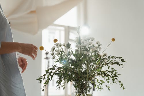 Person Holding White Flower Bouquet