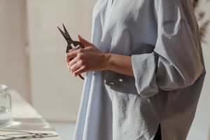 Florist holding a pair of snips, photo by cottonbro studio on Pexels
