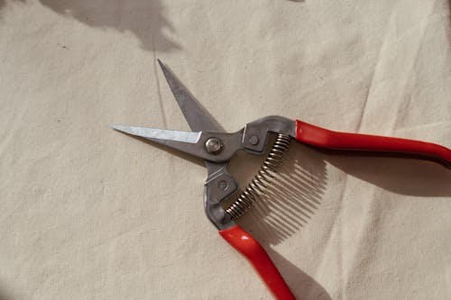 Red and Silver Hand Tool