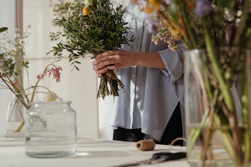 Person Holding Yellow Flower Bouquet