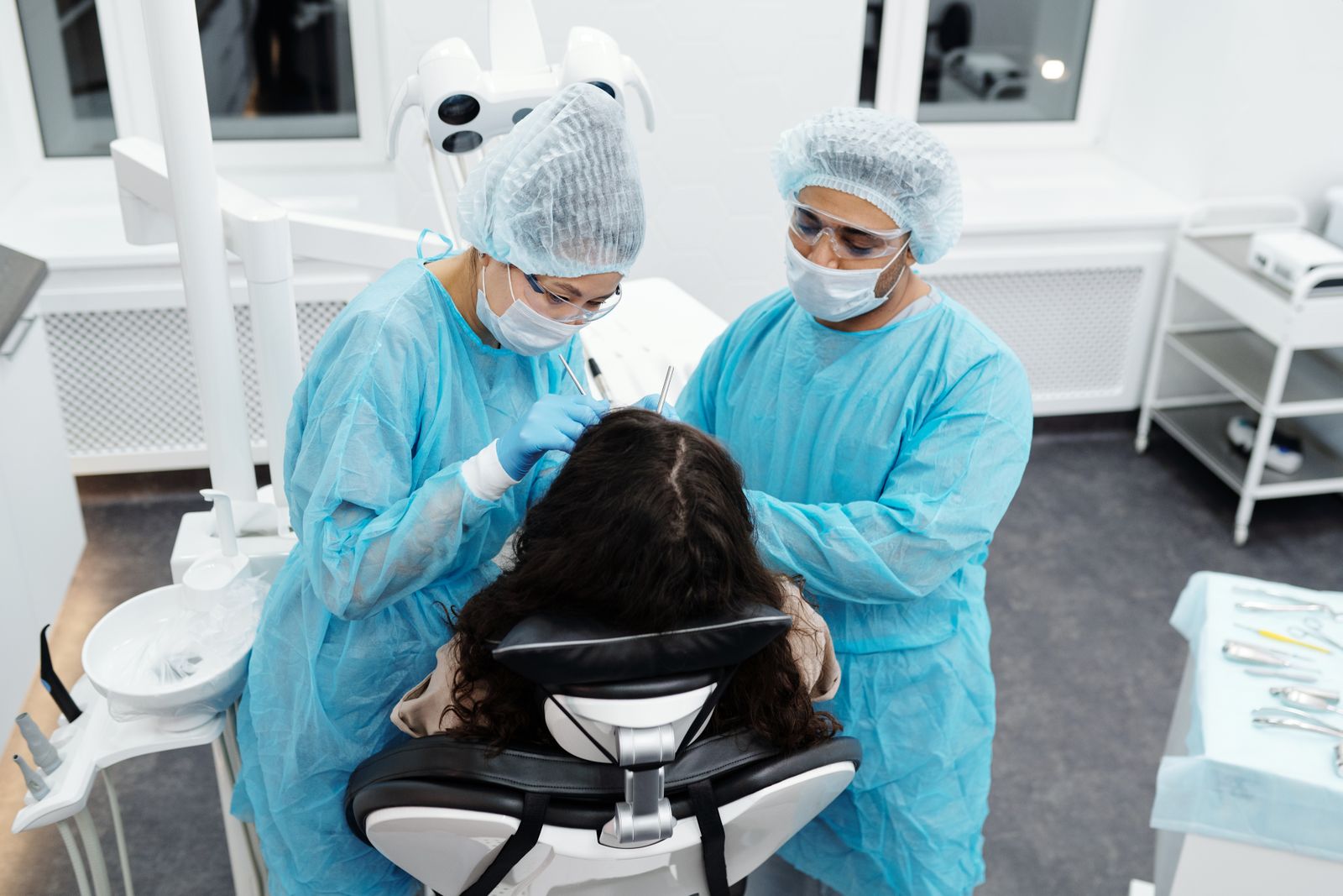 Dental professionals caring for a patient in a modern clinic