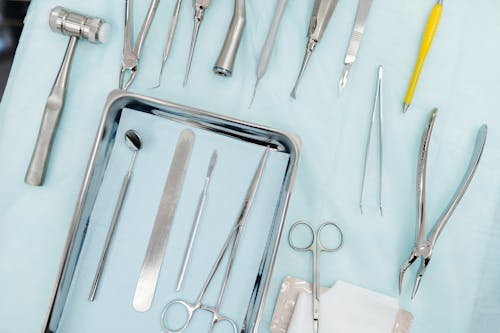 Free Stainless Steel Dental Tools on the White Surface Stock Photo
