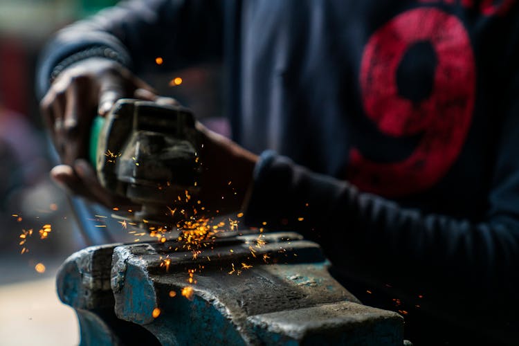 Crop Unrecognizable Black Welder Working With Welding Machine On Factory