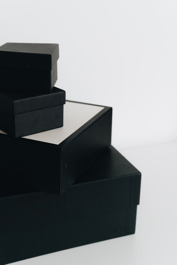 Stack Of Black Boxes Against White Background