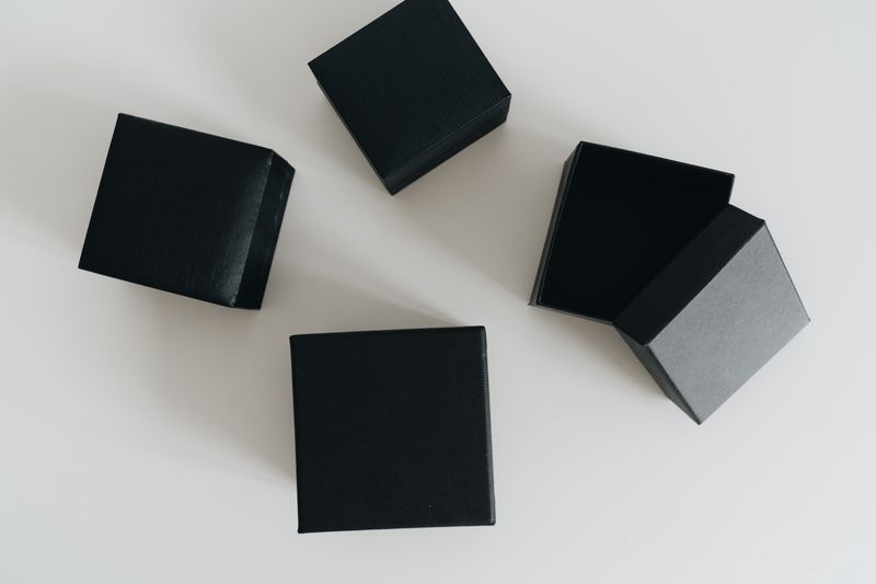 Gift boxes arranged on a pale surface — photo by alleksana on Pexels