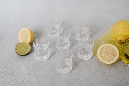 Free Flat Lay Shot of Glasses, Lemons and Limes Stock Photo