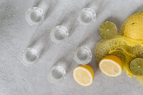Free Flat Lay Shot of Glasses, Lemons and Limes Stock Photo