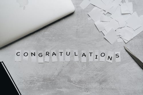 Free Congratulations Text in White Pieces of Paper Stock Photo