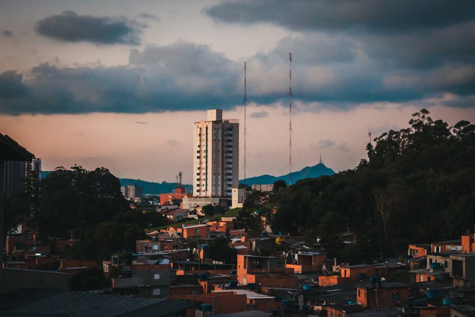 Scenery of old small city district located on highlands against picturesque cloudy sky in evening