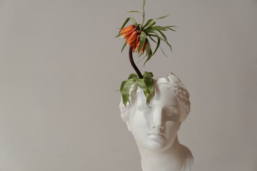 White Ceramic Woman With Red Flower