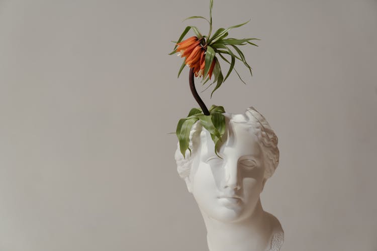 White Ceramic Woman With Red Flower