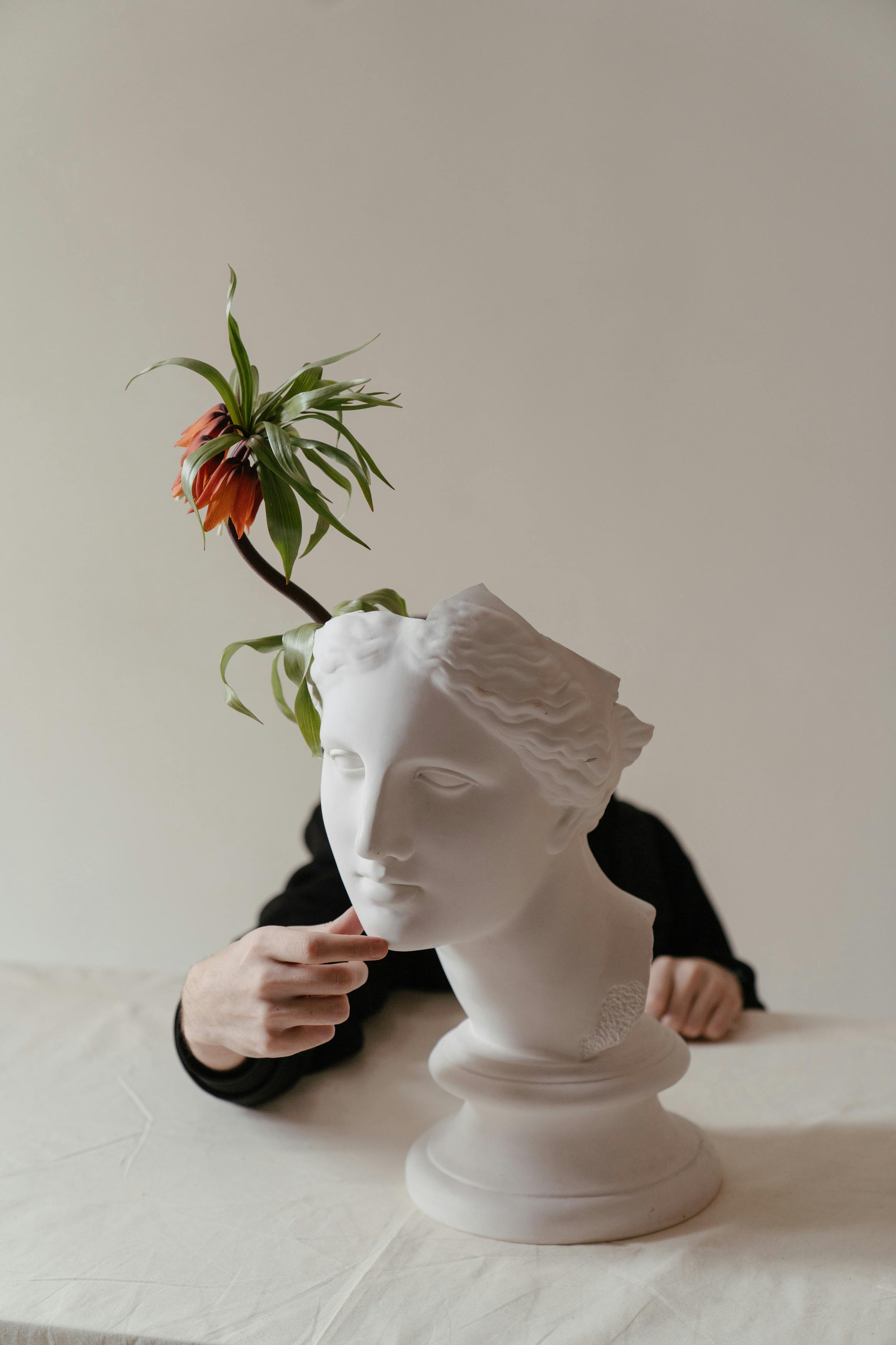 white rose on womans face ceramic figurine