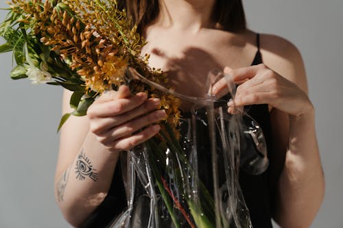 Woman Holding Bouquet of Flowers