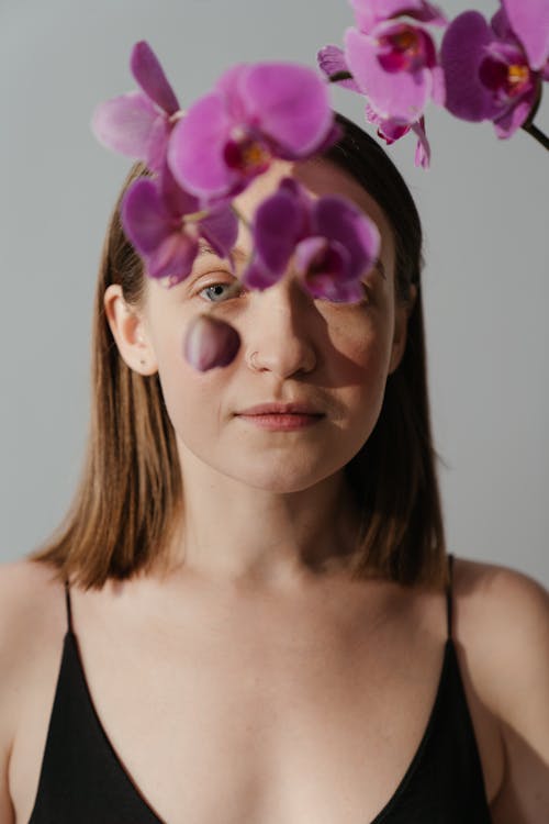 Woman With Purple Flower on Her Head