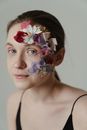 Woman With White and Pink Flower on Her Face