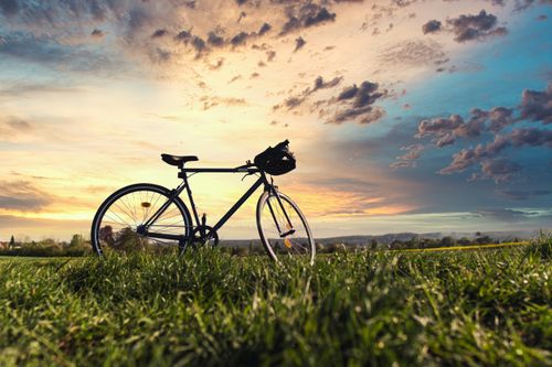 Free A bicycle silhouetted against a dramatic sunset sky in Bad Rodach, Germany. Stock Photo