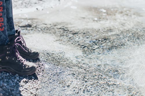 Legs of person standing on ice