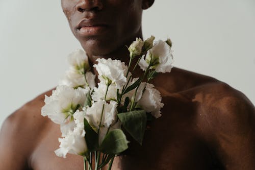 Man Holding White Flower Bouquet