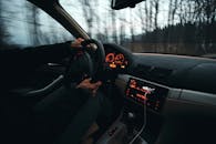 Close-Up Shot of a Person Driving a Car