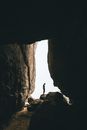 Person Standing on Rock Formation