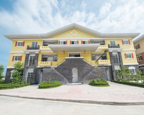 Photo of Home Exterior Under White Clouds