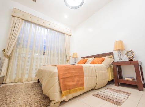 Warm and inviting bedroom featuring chic interior design and modern furnishings.