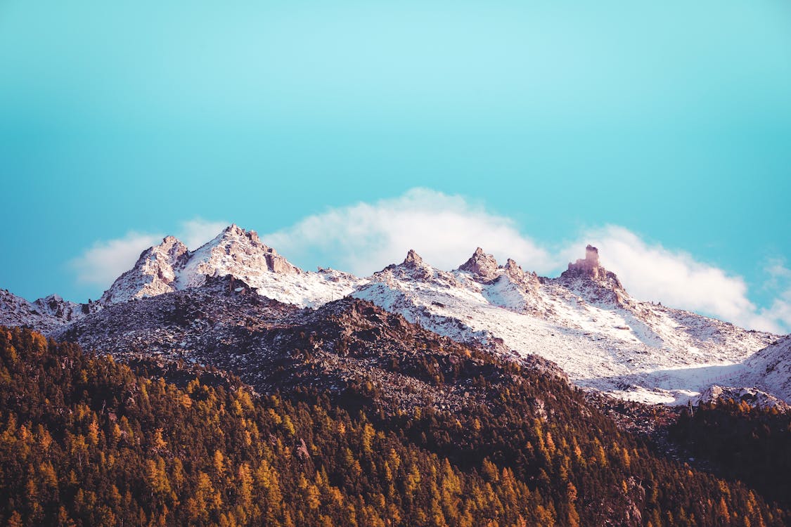 Free Brown and White Mountains Under Blue Sky Stock Photo