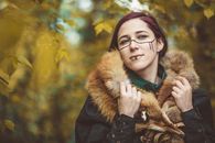 Woman in Black and Brown Fur Coat Wearing Black Framed Eyeglasses