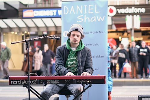 Photo of Man Doing Live Performance of Piano