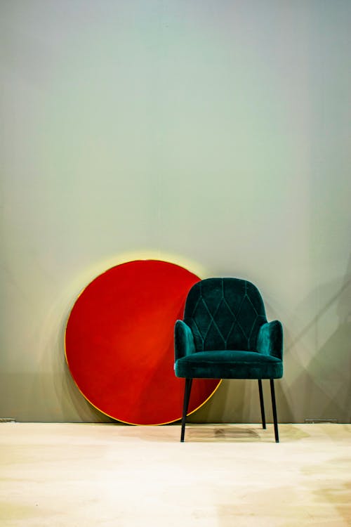 Elegant chair and red circle in room