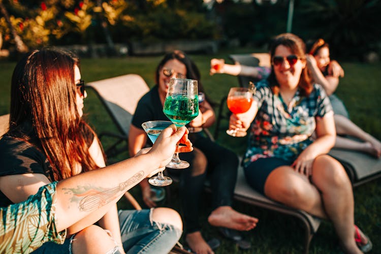 Photo Of People Doing Cheers 