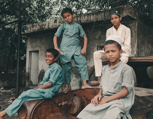 Photo of Boys in Traditional Clothing Posing 