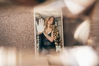 Woman in Black and Brown Leopard Print Long Sleeve Shirt