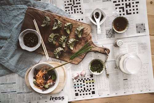 White Ceramic Bowl on Newspaper