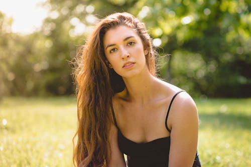 Woman in Black Spaghetti Strap Top Near Trees