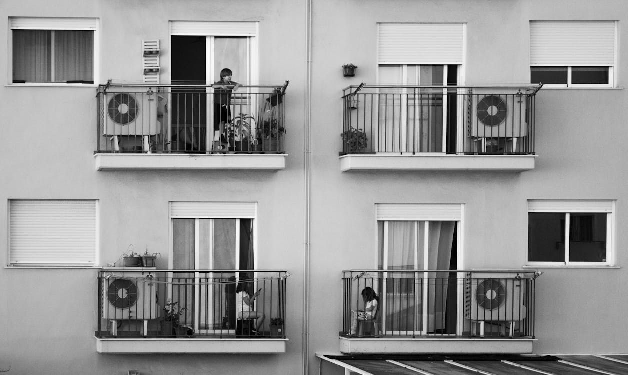 Free Children playing on balconies of modern building Stock Photo