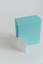 Small present box with blank business card on white background