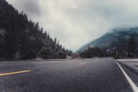 Person Showing Asphalt Road