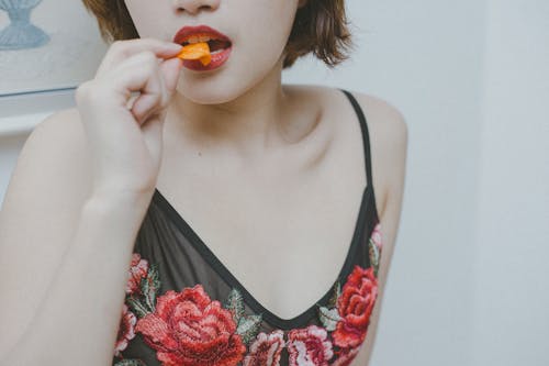 Close Up Of Woman Eating Snack