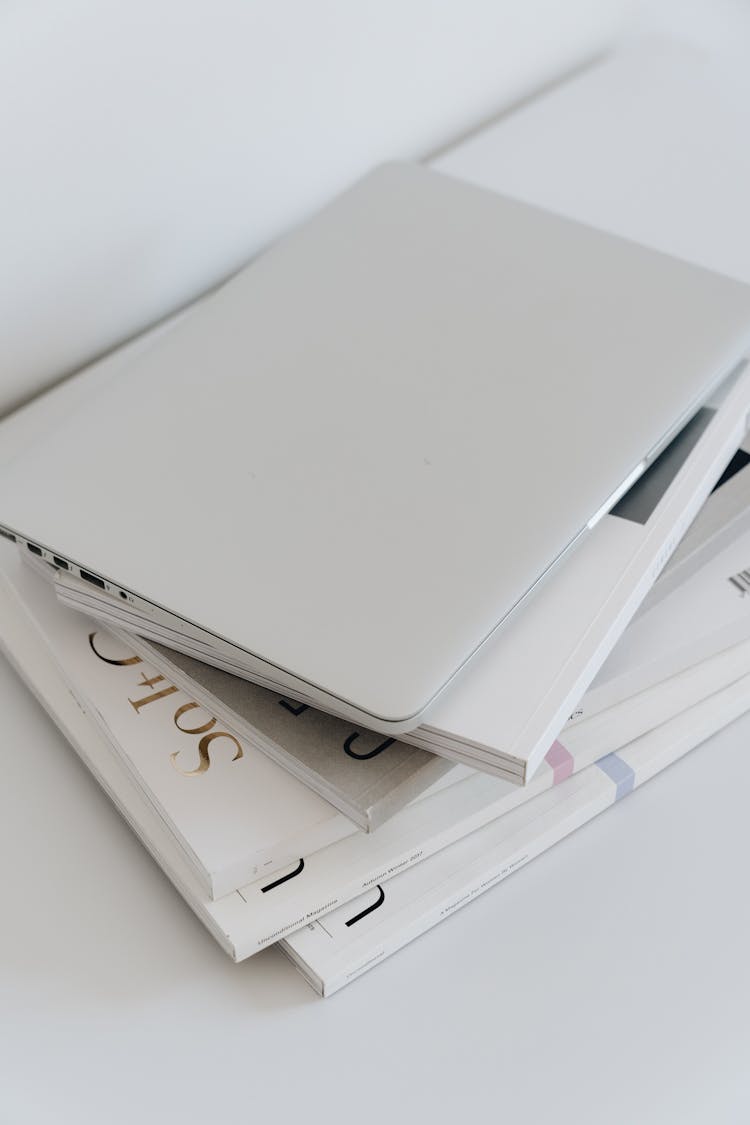 Stack Of Books Against White Background