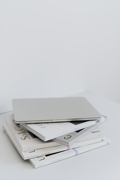 Free White Book on White Surface Stock Photo