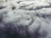 White dense clouds floating over highlands
